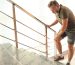 Man on stairs struggling with Chronic Pain before seeing a Neurologist for a diagnosis