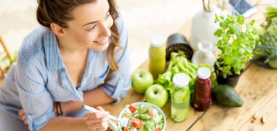 Someone Smiling While Eating Healthy Food