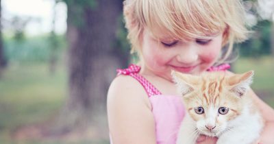 Girl Holding a Cat